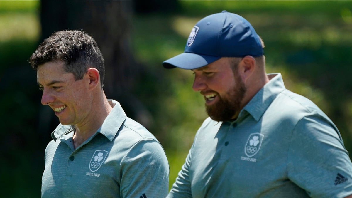 FILE - Ireland's Rory McIlroy and his teammate Shane Lowry speak during a practice round of the men's golf event at the 2020 Summer Olympics, Wednesday, July 28, 2021, at the Kasumigaseki Country Club in Kawagoe, Japan, McIlroy was indifferent about golf in the Olympics when it returned to the program in 2016. Now it's a priority to him.

 - (AP Photo/Matt York, File)
